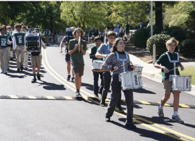 Upper School and Middle School Band leading the homecoming parade
